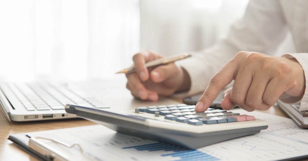 man using calculator