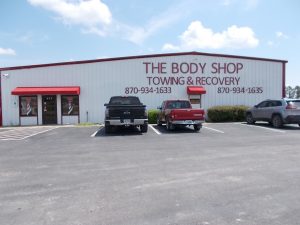 The Body Shop Towing & Recovery, LLC Logo