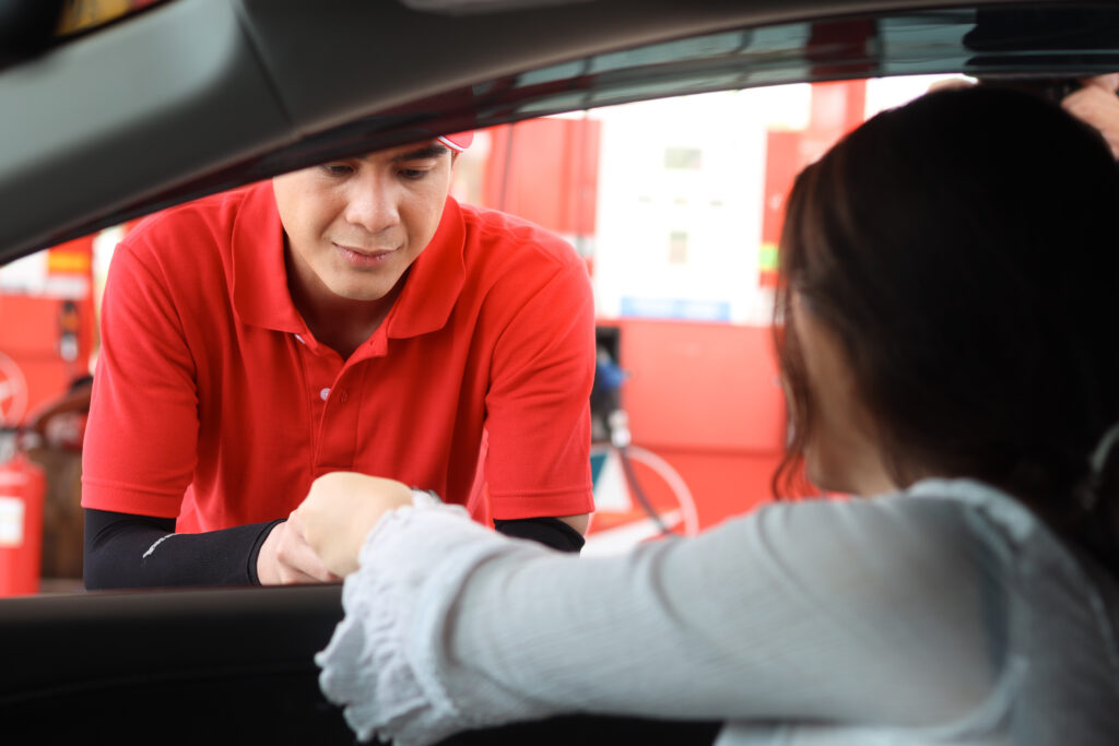 technician taking credit card from woman for payment of services